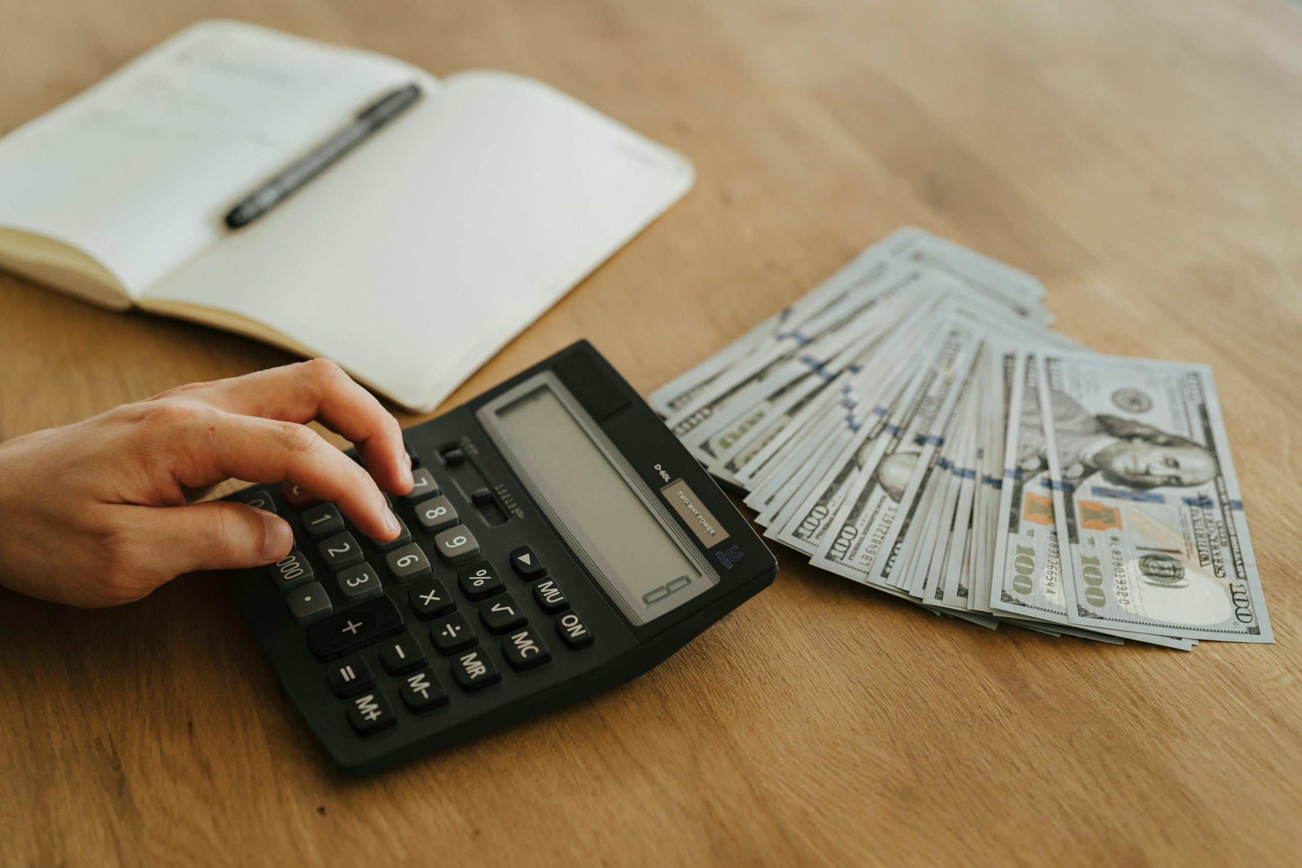 calculator-with-notebook-and-money calculator-with-notebook-and-money